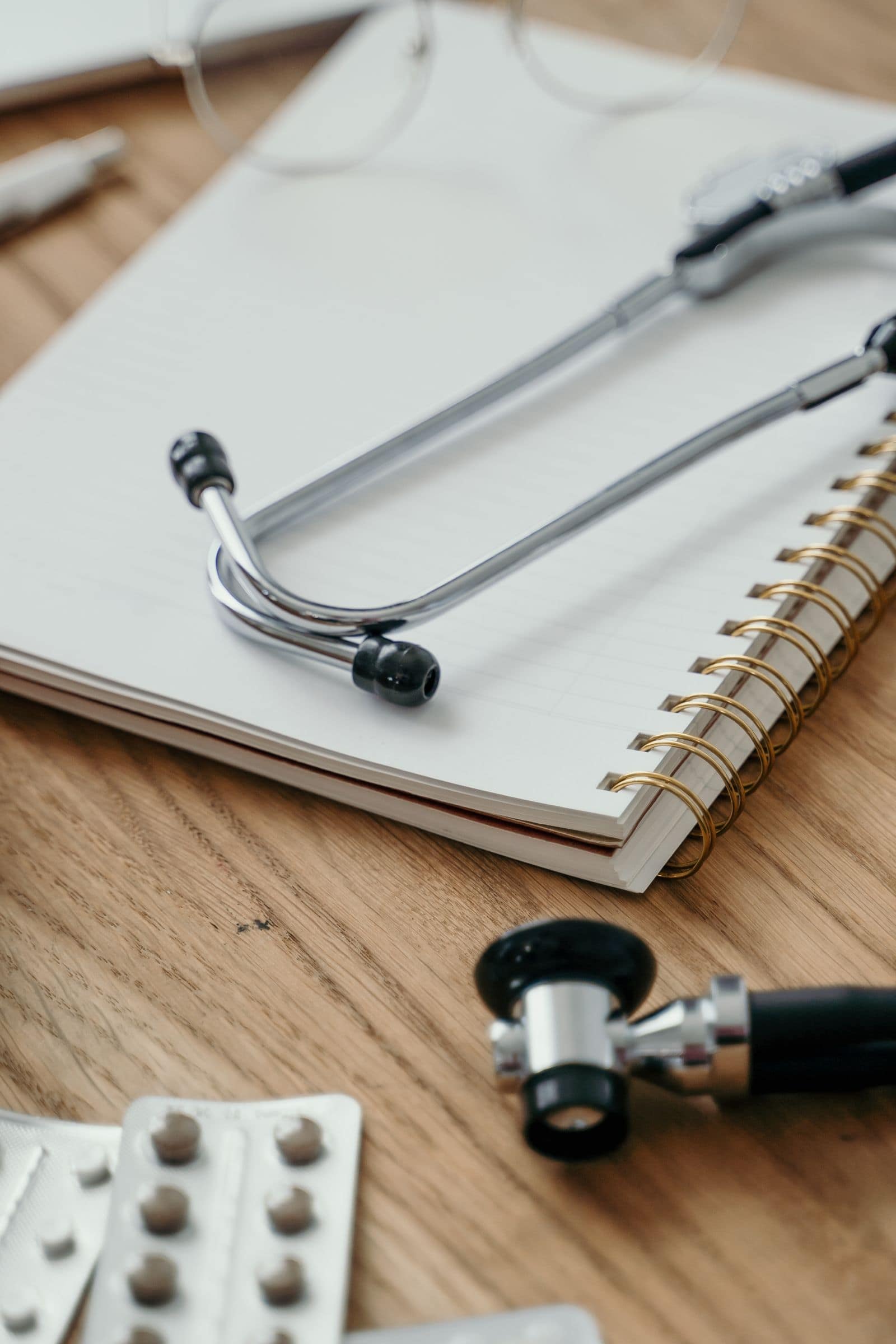 Stethoscope resting on a notebook
